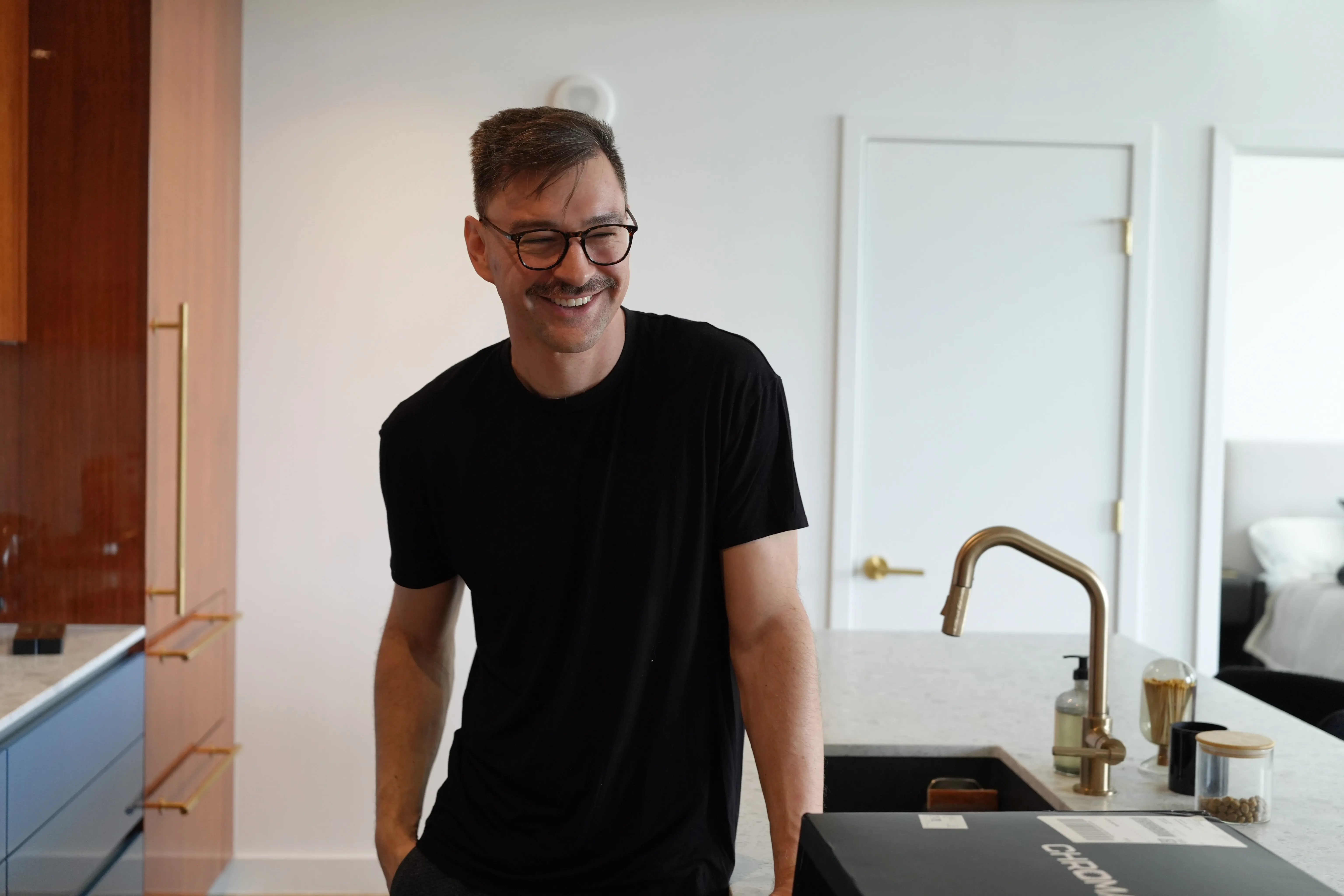 Dan Guido in a kitchen, laughing